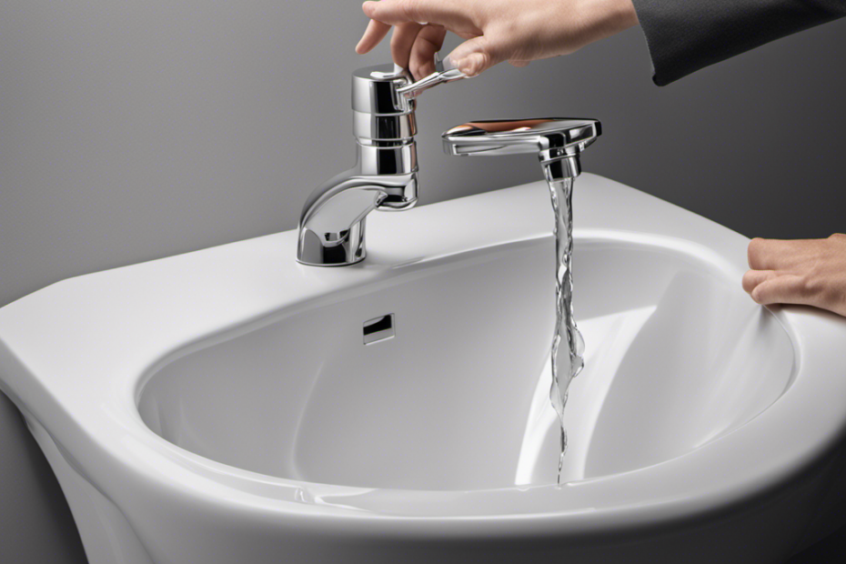 An image showcasing a person's hands reaching for the toilet tank's water valve, gripping it tightly, and turning it clockwise, effectively stopping the water flow